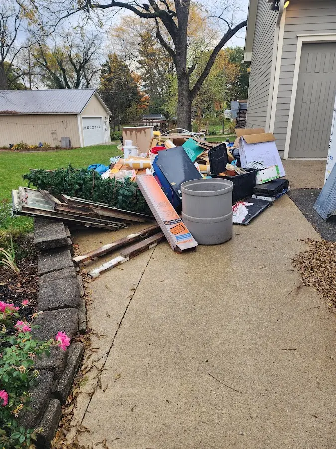 Dumpster being loaded with debris for Residential Dumpster Rental in Palatka